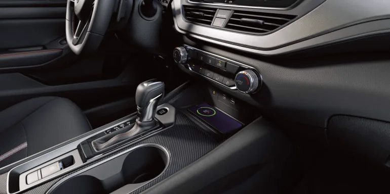 Close up on a phone wirelessly charging in the 2027 Nissan Altima sedan at Reed Nissan Orlando in Orlando FL