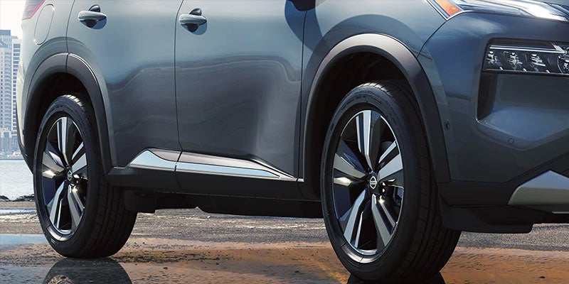 Side view of car tires with detailed tread and rim design
