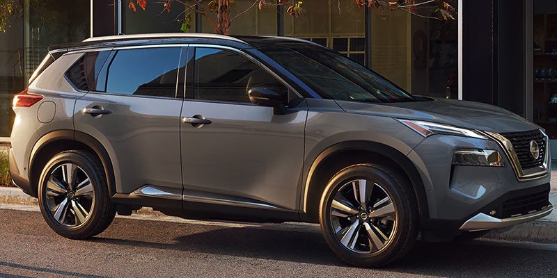 Nissan Rogue Parked on sidewalk